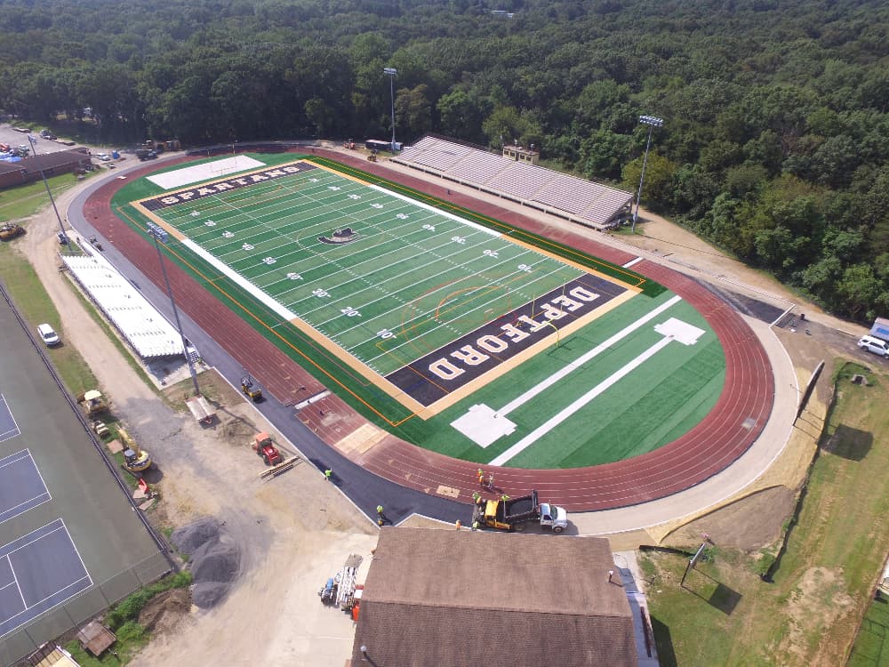 Artificial turf and a running track