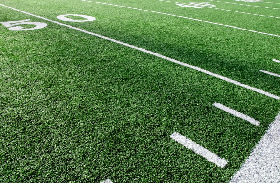 50-yard line on artificial turf football field